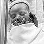 Joseph is registered to the contest to win money with this photo: newborn, baby, sleeping, blanket, knitted_hat, infant, hand, face, peaceful, wrapped, black_and_white, portrait, cute, small_fingers, soft_texture, bed, hospital, resting, cozy, newborn_baby