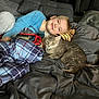 Jubilee joined the competition — help win amazing prizes! bed, blanket, blue_shirt, boy, casual_clothing, cat, child, comfort, cozy, curious, domestic_animal, gray_cat, gray_pants, indoor, pet, pillow, plaid, relaxation, resting, smiling