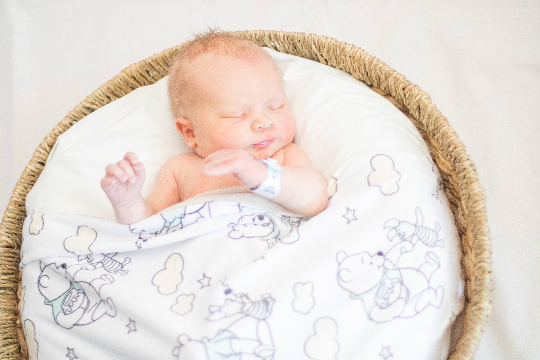 Caleb is registered to the contest to win money with this photo: baby, baby_products, baby_sleeping, baby_toddler_clothing, bedding, child, comfort, fashion_accessory, hand, linens, pattern, person, portrait_photography, room, sitting, skin, sleeve, textile, toddler, wood