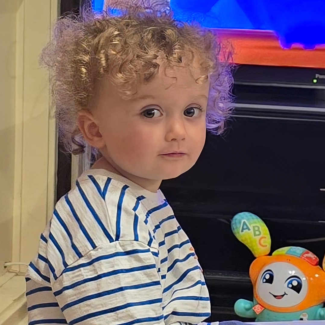 Arlo joined the competition — help win amazing prizes! baby, balloon, blonde, bodypart, crawling, curlyhair, face, finger, hair, hand, happy, head, mohawkhairstyle, person, photography, portrait, smile, sphere, toy, wig