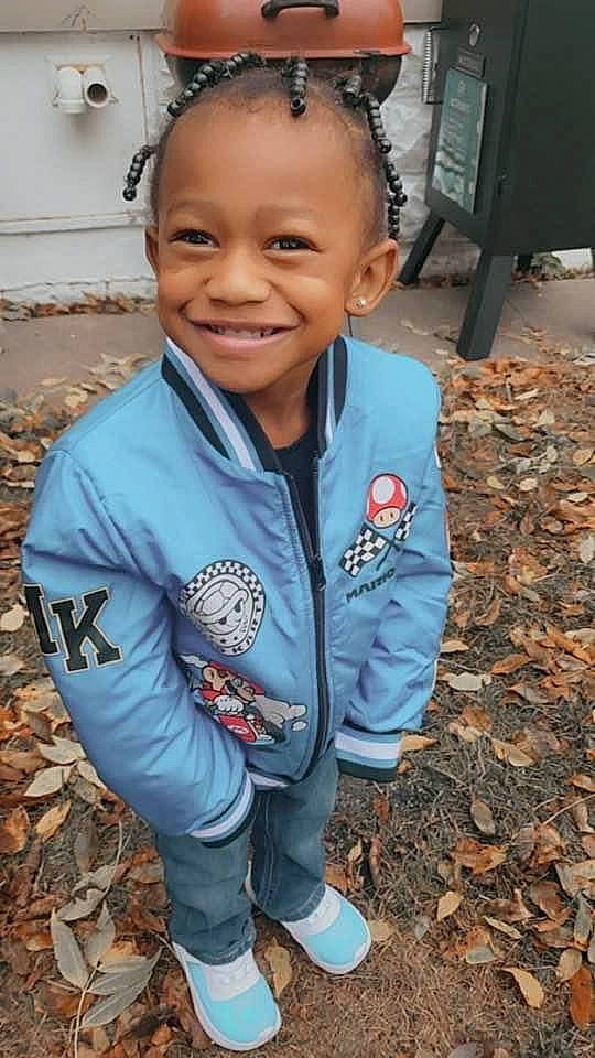 Treshun joined the competition — help win amazing prizes! child, clothing, face, fun, grass, happy, hoodie, iris, joy, laugh, person, sitting, skin, smile, soil, t_shirt, tire, toddler, tree, vacation