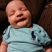 William is registered to the contest to win money with this photo: baby, clothing, cushion, face, glove, happy, hat, head, homedecor, newborn, person, photography, portrait, sleeping, smile, t_shirt
