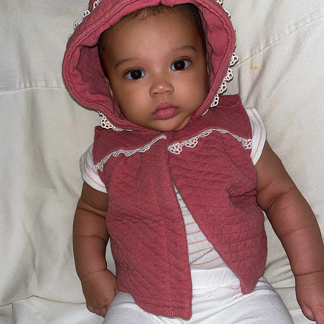 Ena joined the competition — help win amazing prizes! arm, baby, child, clothing, curious_eyes, cute, fabric, face, hand, hood, indoors, infant, lace, pink, portrait, sitting, skin, vest, white_pants, young