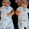 Karsen joined the competition — help win amazing prizes! baby, infant, twin, lying_down, white_clothing, bib, hand, child, bed, pajamas, cute, sleepwear, matching_outfits, person, face, headwear, indoor, soft_lighting, newborn, family