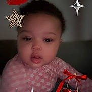 Shaniya is registered to the contest to win money with this photo: baby, cherries, child, closeup, curious, cute, digital_stickers, face, hand, indoor, leopard_print, lipstick_kiss, patterned_clothing, person, pink_clothing, portrait, red_bow, soft_lighting, stars, young_child