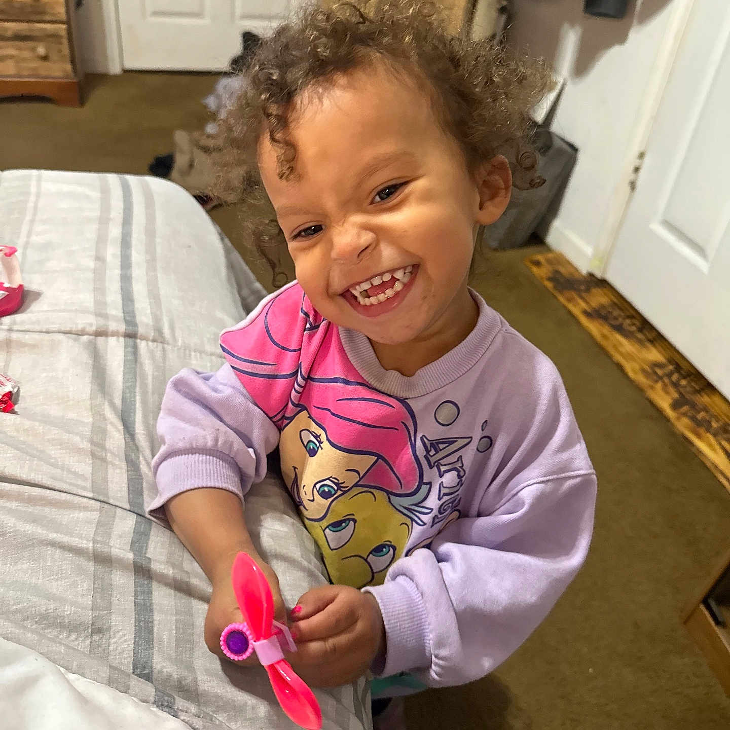 Kynzley is registered to the contest to win money with this photo: baby, babylaughing, bed, bedroom, clothing, curlyhair, face, furniture, hair, happy, head, indoors, laughing, person, photography, portrait, room, sitting, smile, t_shirt