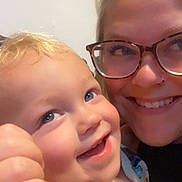 Beckham joined the competition — help win amazing prizes! child, toddler, woman, glasses, smile, face, closeup, blond_hair, blue_eyes, happy, family, portrait, indoor, skin, person, cute, cheerful, love, affection, cozy
