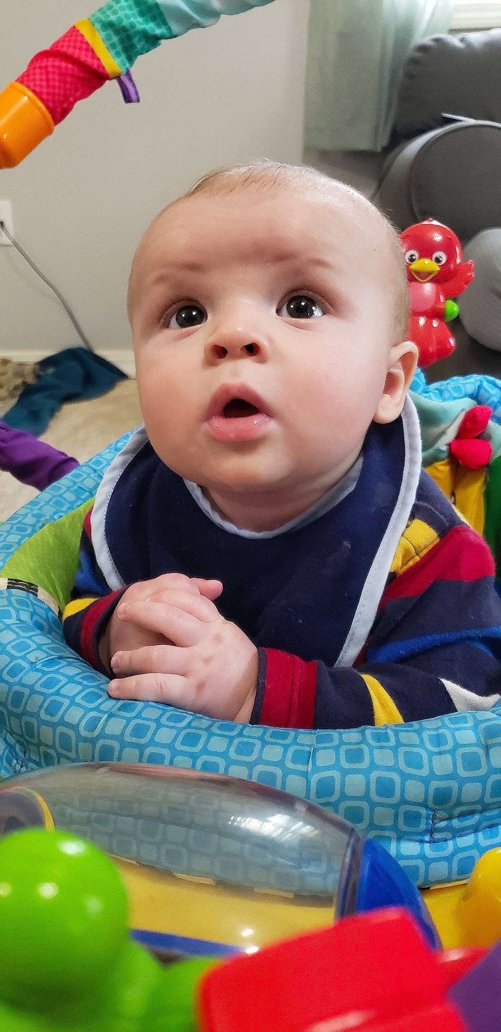 Jace is registered to the contest to win money with this photo: baby, baby_playing_with_toys, baby_products, baby_toys, cheek, child, face, nose, person, play, product, skin, smile, surprise, toddler, toy