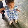 Sophia joined the competition — help win amazing prizes! toddler, child, baby, walking, floor, tiles, blue_flower_dress, person, adult_support, hands, legs, white_shoes, hair_bow, indoor, learning_to_walk, cute, small_child, flooring, support, early_steps