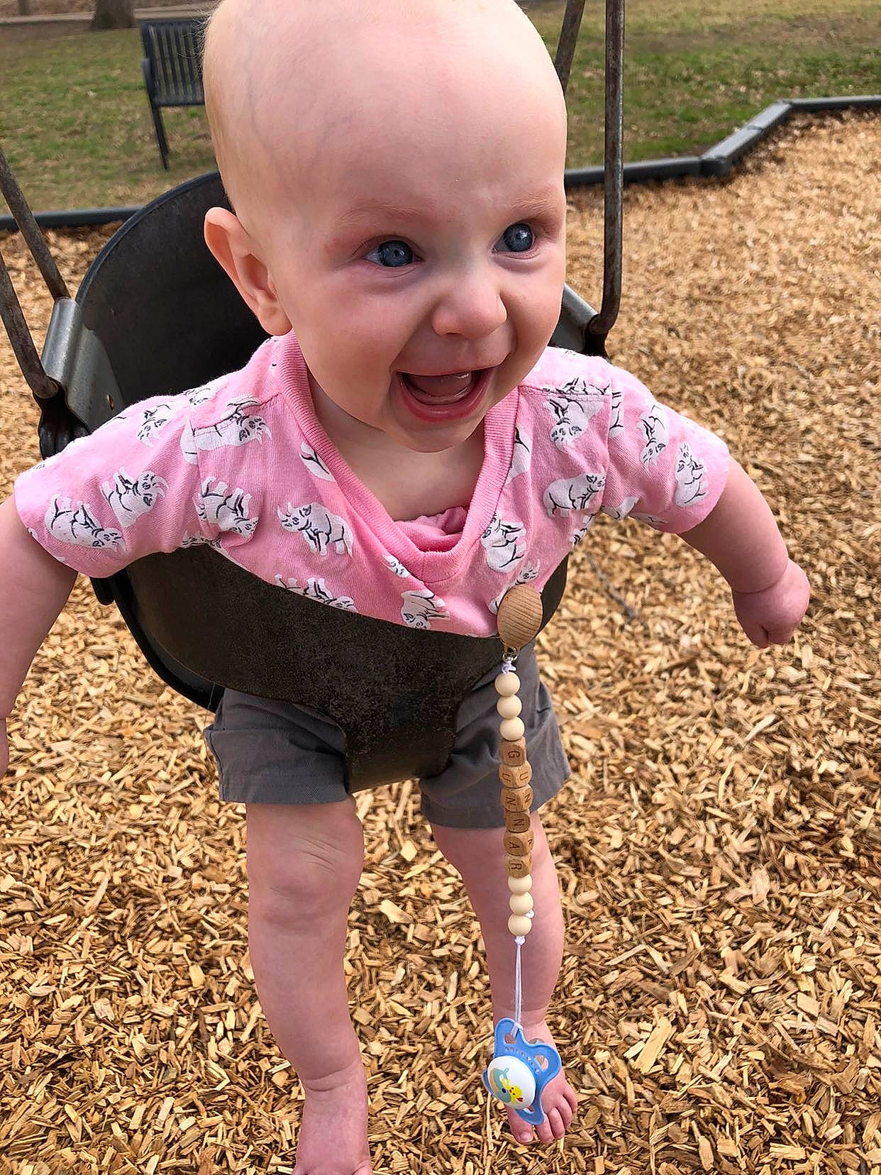 Gunnar joined the competition — help win amazing prizes! baby, baby_toddler_clothing, chair, cheek, child, eye, face, facial_expression, finger, grass, hand, happy, head, leisure, people_in_nature, person, pink, public_space, skin, smile