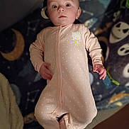 Roselynn joined the competition — help win amazing prizes! baby, infant, onesie, pink_clothing, polka_dots, face, lying_down, blanket, space_theme, moon, stars, cute, child, portrait, indoors, soft_lighting, young_child, expression, sleepwear, person