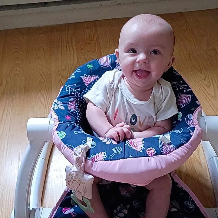 Roselynn joined the competition — help win amazing prizes! baby, smiling, baby_walker, floor, wooden_floor, infant, child, happy, sitting, toy, clothing, indoor, person, face, cute, bright, colorful, pattern, young, playful