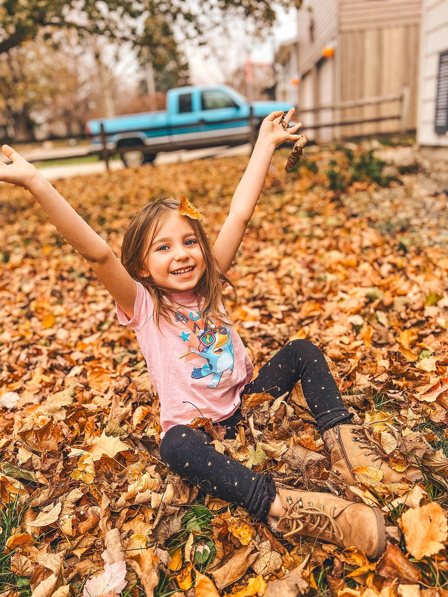 Stella is registered to the contest to win money with this photo: blond, brown_hair, child, deciduous, field, flash_photography, fun, grass, hairstyle, happy, joy, leisure, people_in_nature, person, plant, pumpkin, smile, soil, toddler, tree