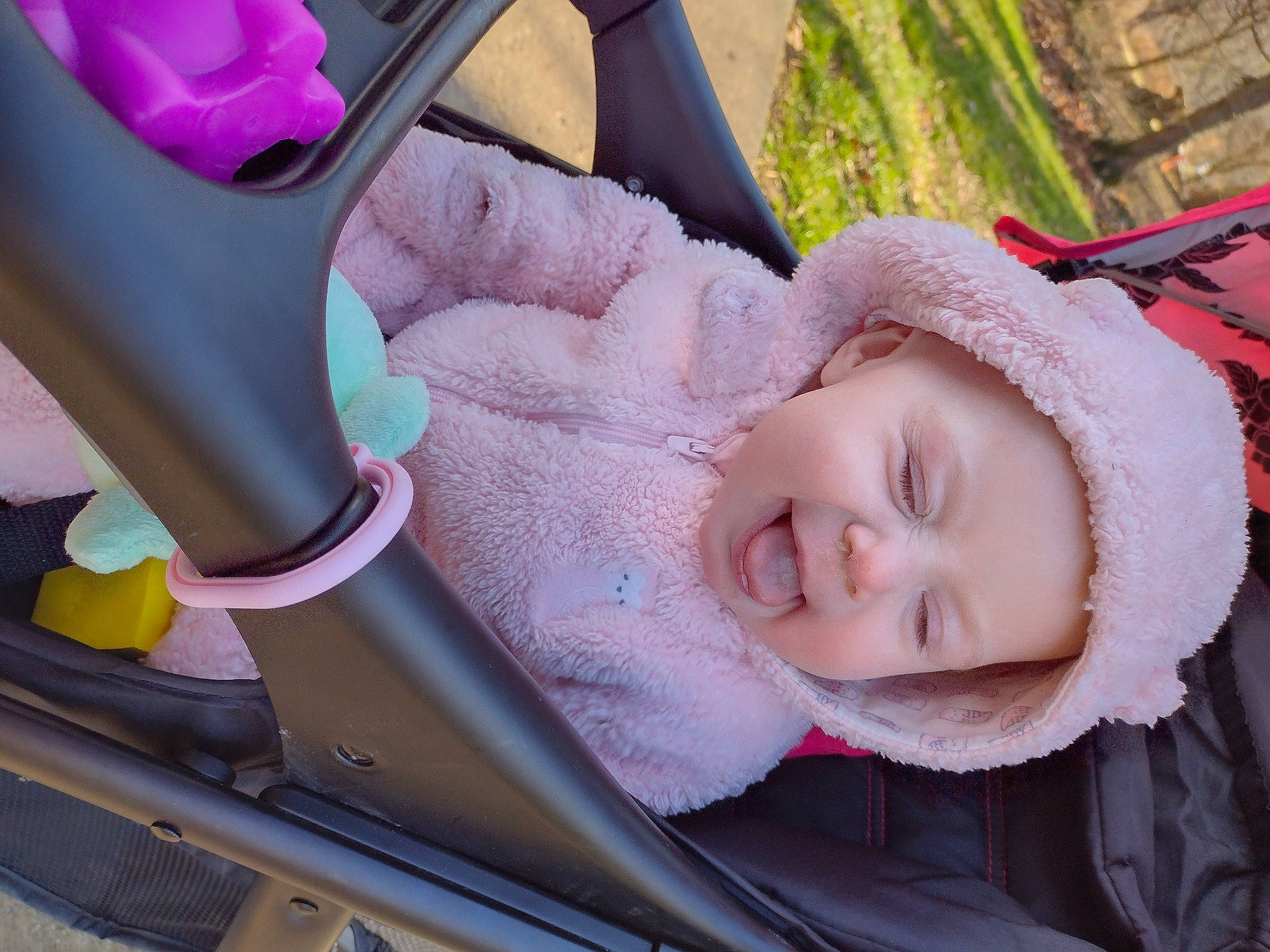 Elaina is registered to the contest to win money with this photo: baby, baby_carriage, car_seat, child, fun, grass, happy, headwear, human_body, mammal, organ, person, pink, plant, product, skin, smile, textile, toddler, tree