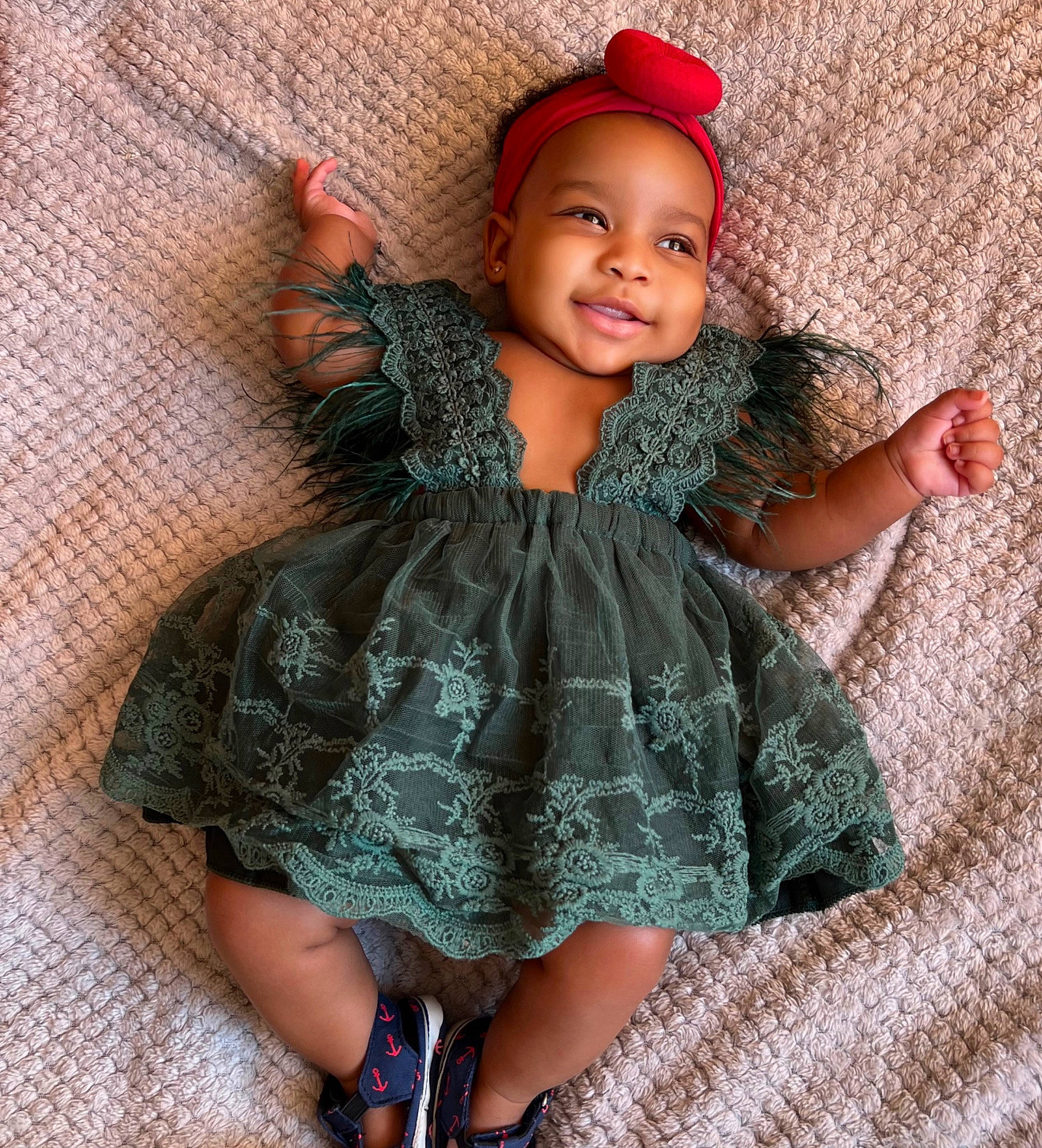 Kayla is registered to the contest to win money with this photo: arm, baby_toddler_clothing, cap, day_dress, doll, dress, face, hat, head, headgear, human_body, human_leg, joy, one_piece_garment, pattern, person, pink, skin, sleeve, smile