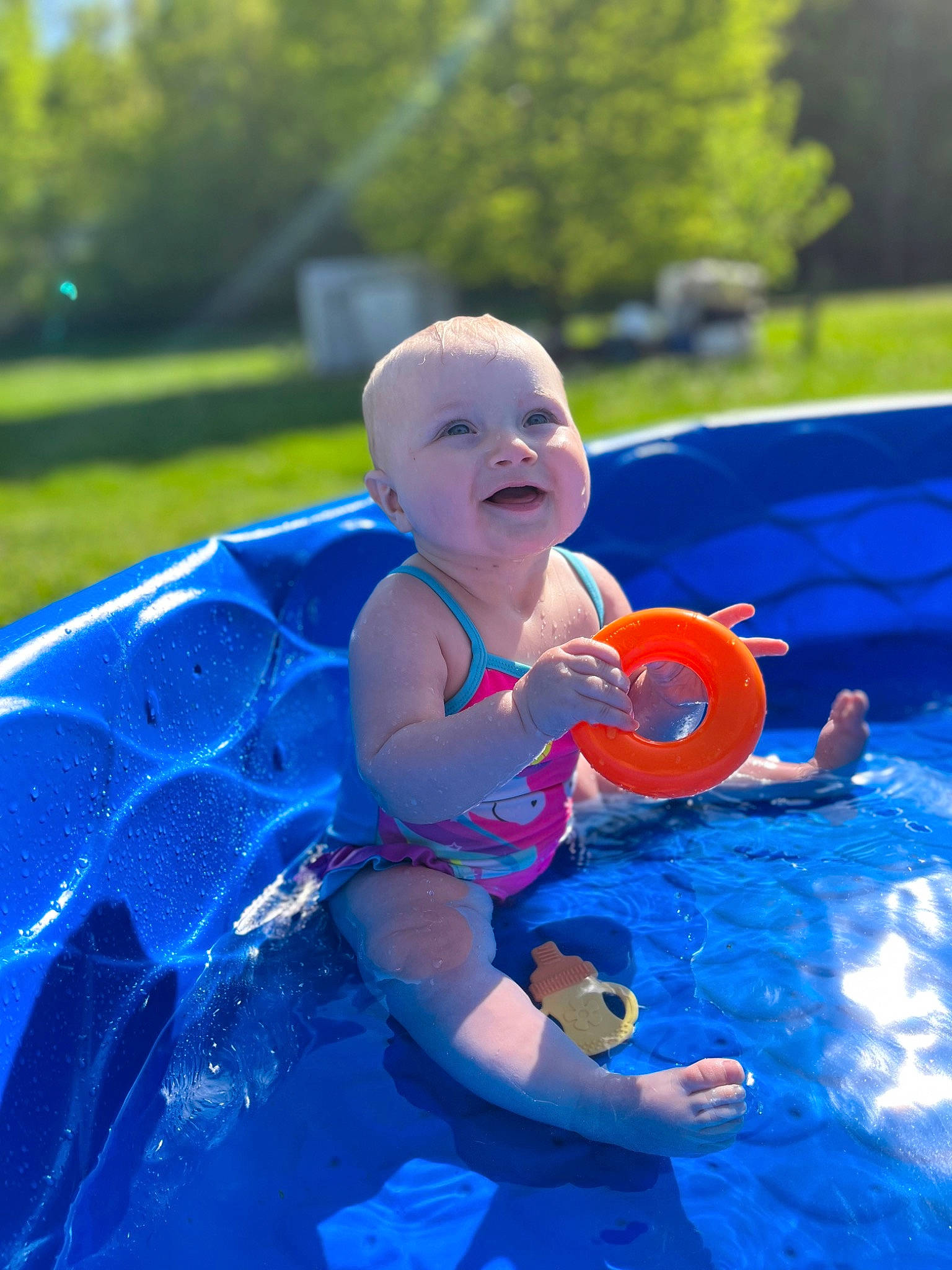 London joined the competition — help win amazing prizes! aqua, azure, baby, baby_toddler_clothing, blue, electric_blue, fun, games, grass, happy, leisure, outdoor_recreation, people_in_nature, person, recreation, smile, swimming_pool, toddler, tree, water