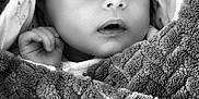 Seven participe au concours pour gagner de l'argent avec cette photo : baby, black_and_white, blanket, child, closeup, cozy, cute, face, hand, infant, monochrome, newborn, peaceful, portrait, resting, sleeping, soft_texture, toddler, warm, wrapped