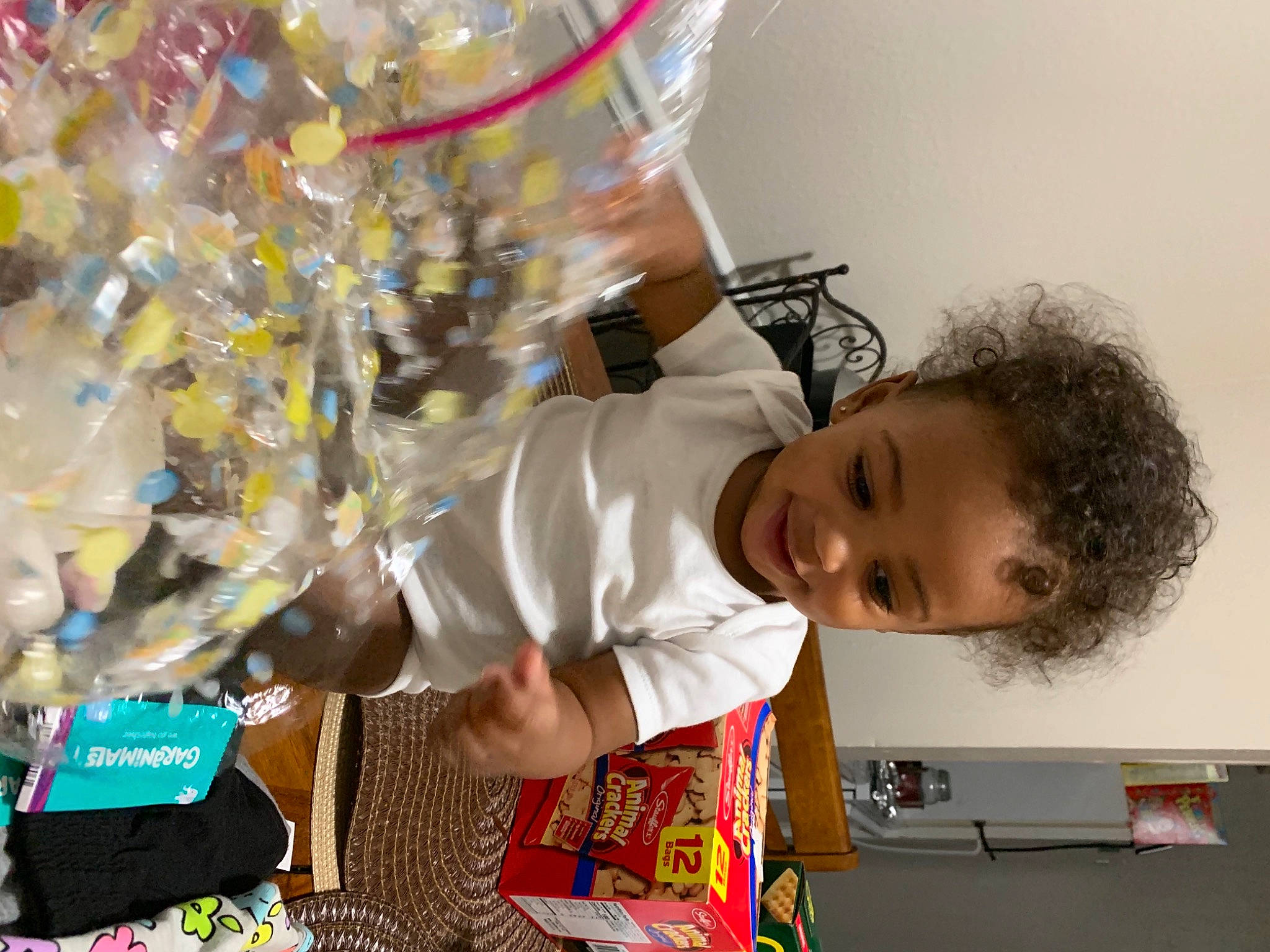 Amaurice is registered to the contest to win money with this photo: art, baby, baby_toddler_clothing, child, event, fun, happy, party_supply, person, plastic, play, room, t_shirt, toddler, visual_arts