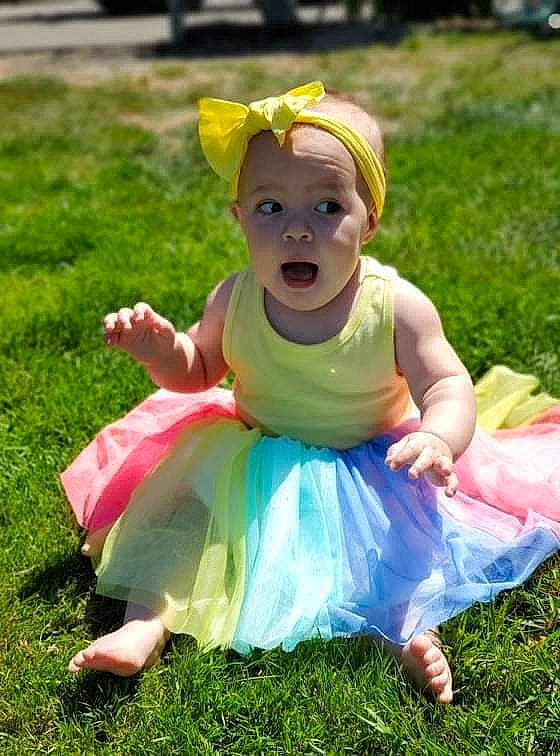 Ryleigh joined the competition — help win amazing prizes! baby, baby_toddler_clothing, child, event, fun, garden, grass, grassland, happy, headwear, leisure, magenta, people_in_nature, person, pink, plant, play, recreation, sandal, sitting