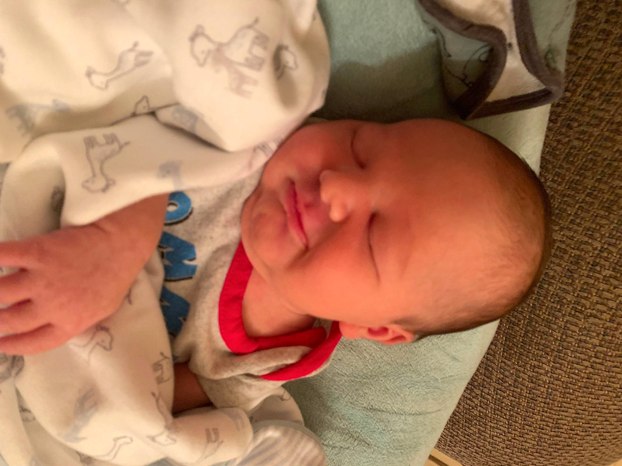 Weston is registered to the contest to win money with this photo: baby, baby_sleeping, baby_toddler_clothing, bedtime, cheek, comfort, eyebrow, facial_expression, finger, gesture, happy, linens, lip, mouth, neck, nose, person, skin, smile, thumb