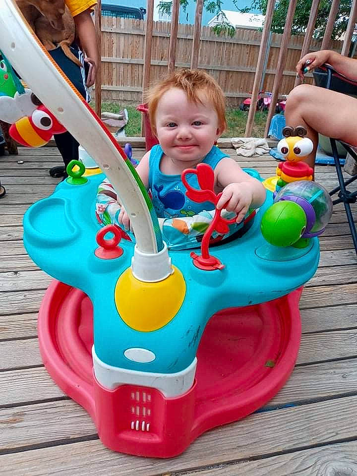 Noah joined the competition — help win amazing prizes! baby, baby_playing_with_toys, baby_toddler_clothing, blue, child, city, event, fun, green, happy, human_settlement, joy, leisure, outdoor_play_equipment, person, plastic, playground, recreation, riding_toy, shorts