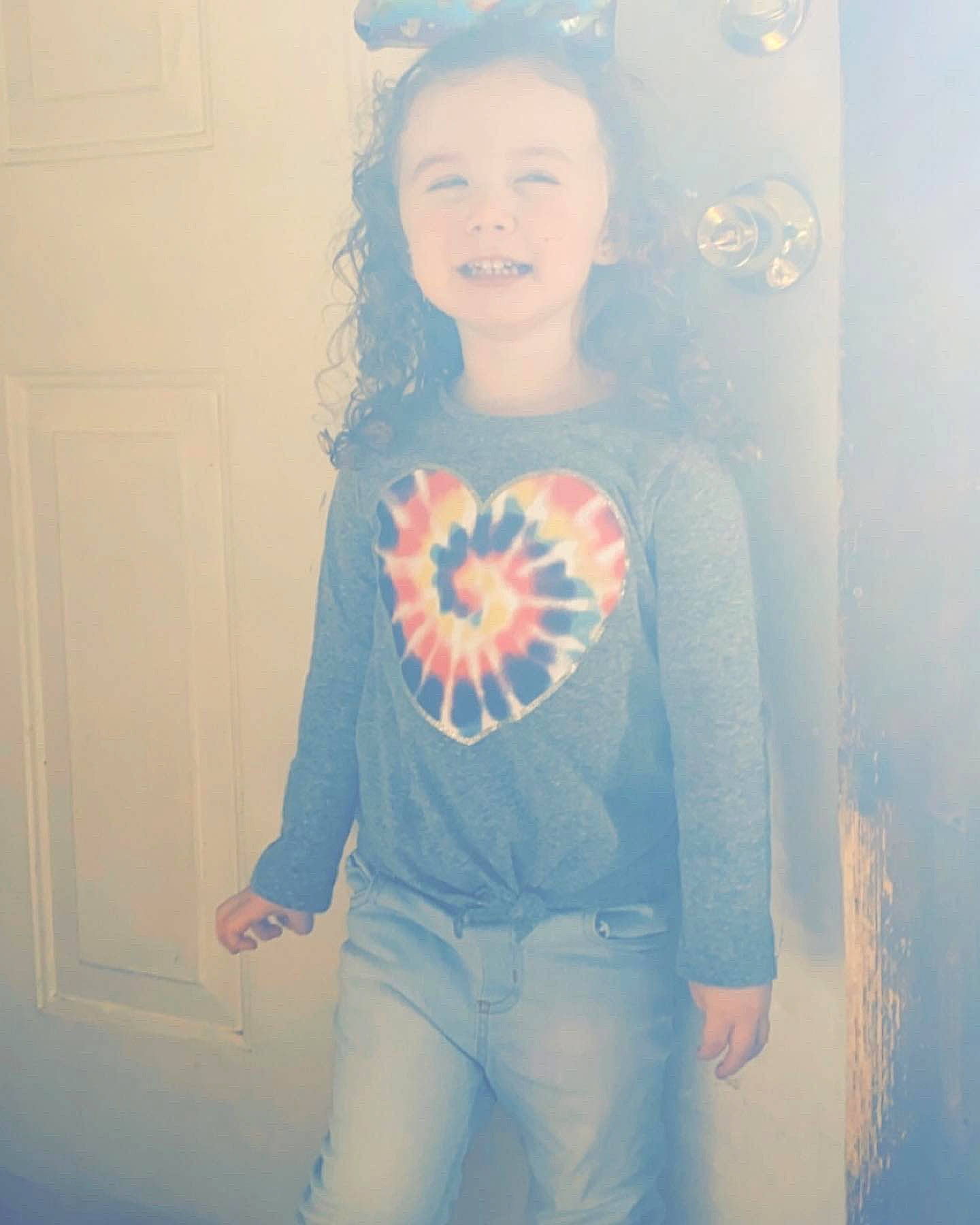 Janelle is registered to the contest to win money with this photo: arm, azure, chest, cool, eye, eyewear, facial_expression, fashion, hairstyle, happy, human_body, joy, person, plant, sleeve, standing, street_fashion, t_shirt, textile, tints_and_shades