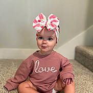 Blakely joined the competition — help win amazing prizes! baby, child, sitting, carpet, pink_sweatshirt, headband, bow, indoor, stairs, cute, portrait, young_child, clothing, floor, person, blue_eyes, expression, skin, long_sleeves, infant