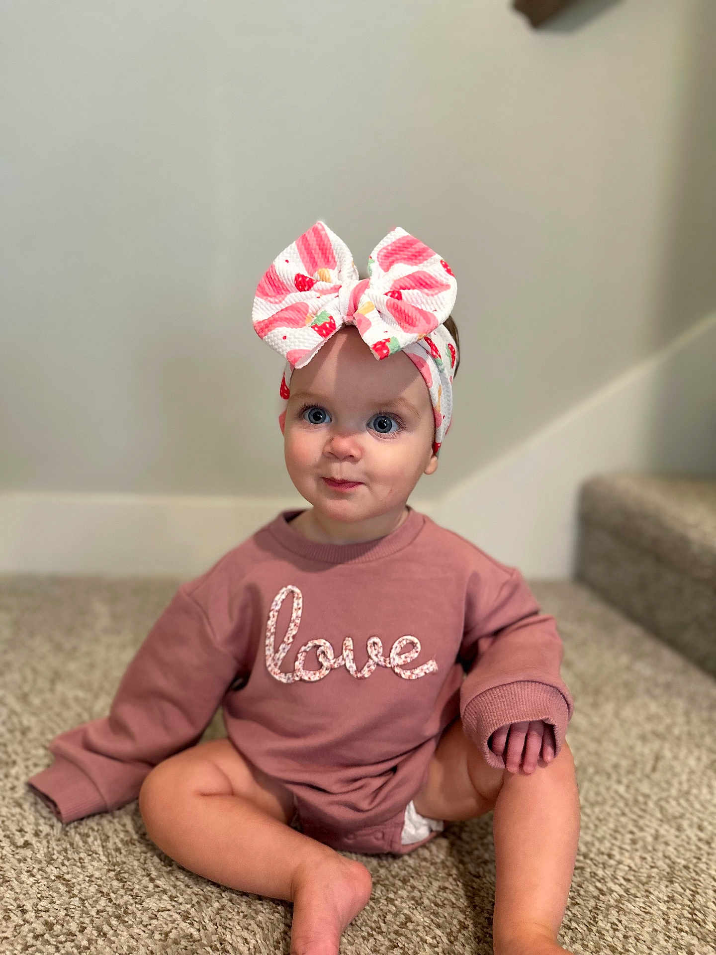 Blakely joined the competition — help win amazing prizes! baby, child, sitting, carpet, pink_sweatshirt, headband, bow, indoor, stairs, cute, portrait, young_child, clothing, floor, person, blue_eyes, expression, skin, long_sleeves, infant