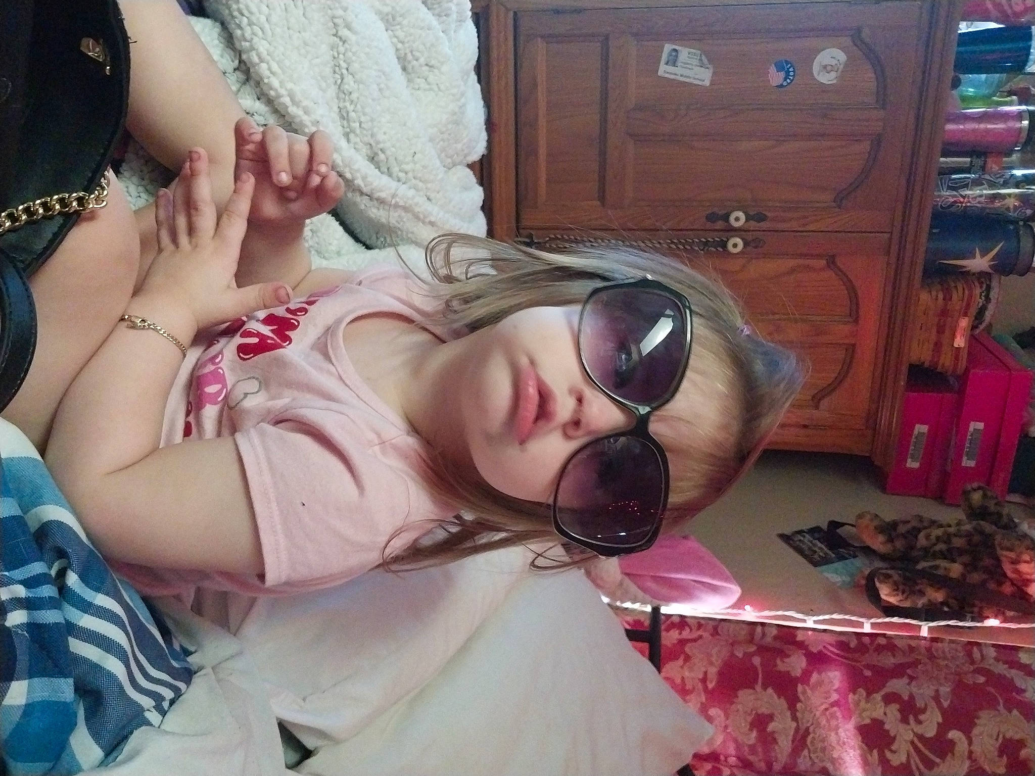 Ariasky is registered to the contest to win money with this photo: black_hair, cabinetry, chest_of_drawers, child, cool, cupboard, drawer, eyelash, eyewear, facial_expression, fun, goggles, hairstyle, mouth, person, pink, skin, sunglasses, textile, thigh