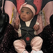 Malaysia joined the competition — help win amazing prizes! baby, infant, car_seat, pink_headband, white_shirt, pink_pants, white_booties, black_harness, seatbelt, evenflo, child, cute, curious, indoors, sitting, safety, young_child, expression, portrait, person