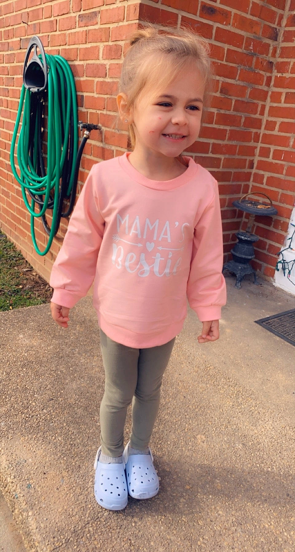 Adrijana is registered to the contest to win money with this photo: active_pants, baby_toddler_clothing, brick, brickwork, garden_hose, hose, joy, laugh, leggings, person, pink, sock, standing, style, sweatpant, walking_shoe