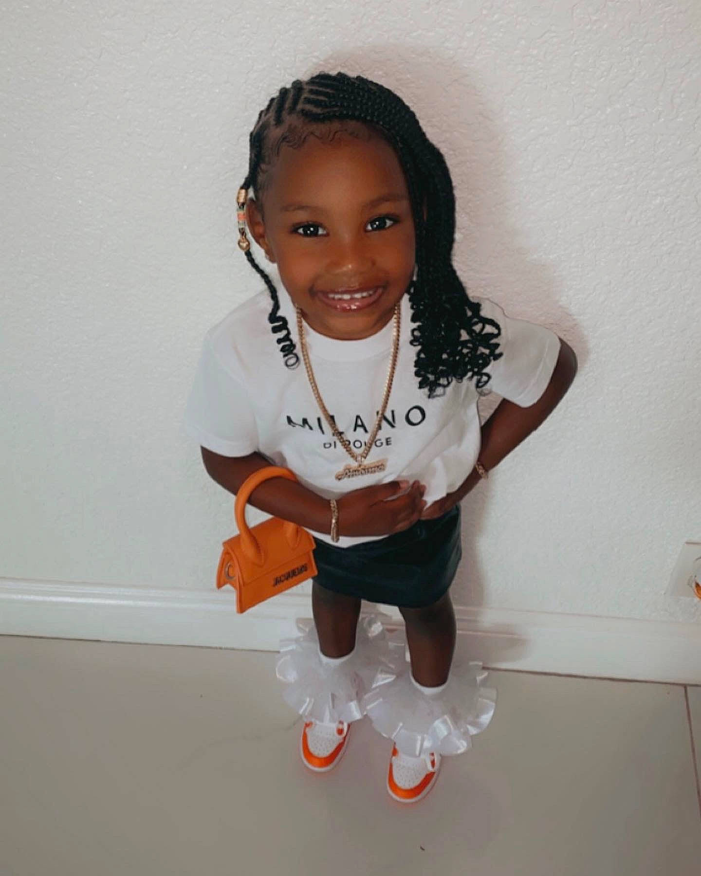 Amoura Rogers joined the competition — help win amazing prizes! baby_toddler_clothing, cheek, chin, face, flooring, gesture, hair, happy, head, human_body, human_leg, joy, knee, leg, outerwear, person, sleeve, smile, t_shirt, thigh