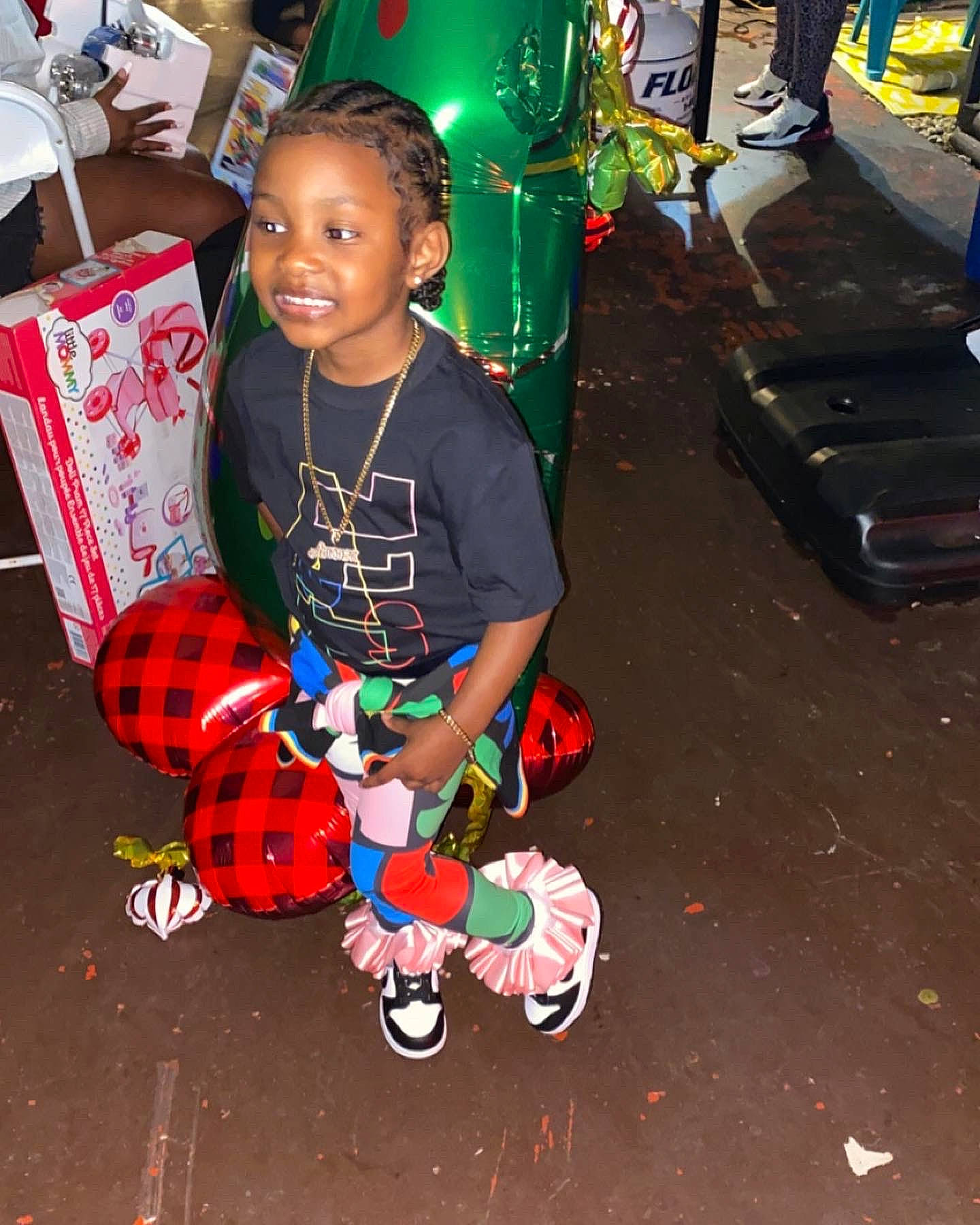 Amoura Rogers joined the competition — help win amazing prizes! baby, carmine, child, event, flooring, fun, holiday, joy, leisure, pattern, person, play, sandal, shoe, shorts, sitting, smile, sneakers, spider_man, t_shirt