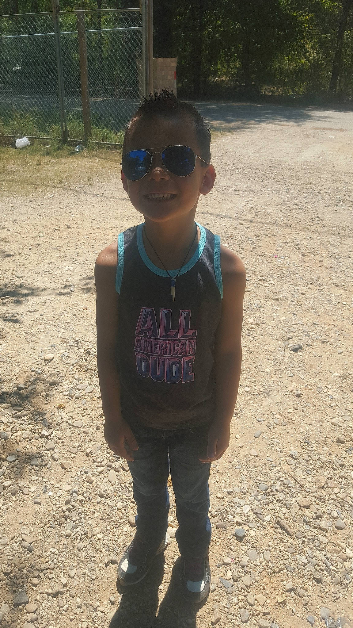 Nicolay is registered to the contest to win money with this photo: child, cool, eyewear, glasses, person, smile, t_shirt, vacation