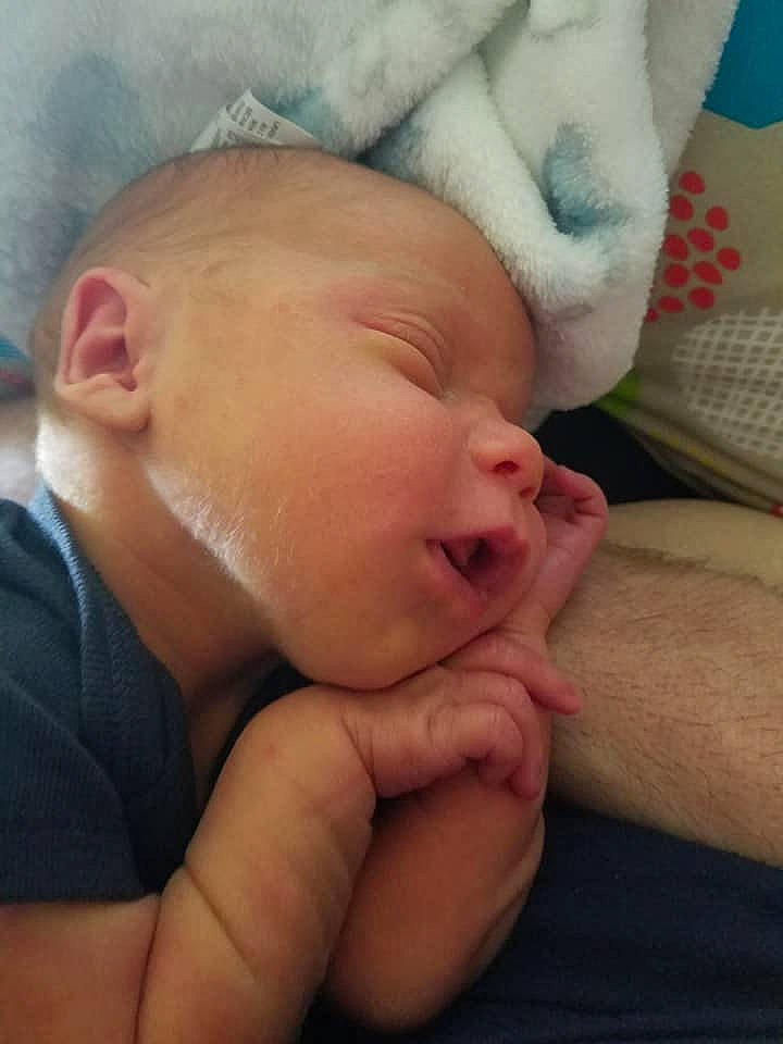 Paxxon is registered to the contest to win money with this photo: arm, baby, birth, cheek, child, chin, face, forehead, hand, head, lip, mouth, muscle, nap, neck, nose, person, skin, sky, sleep