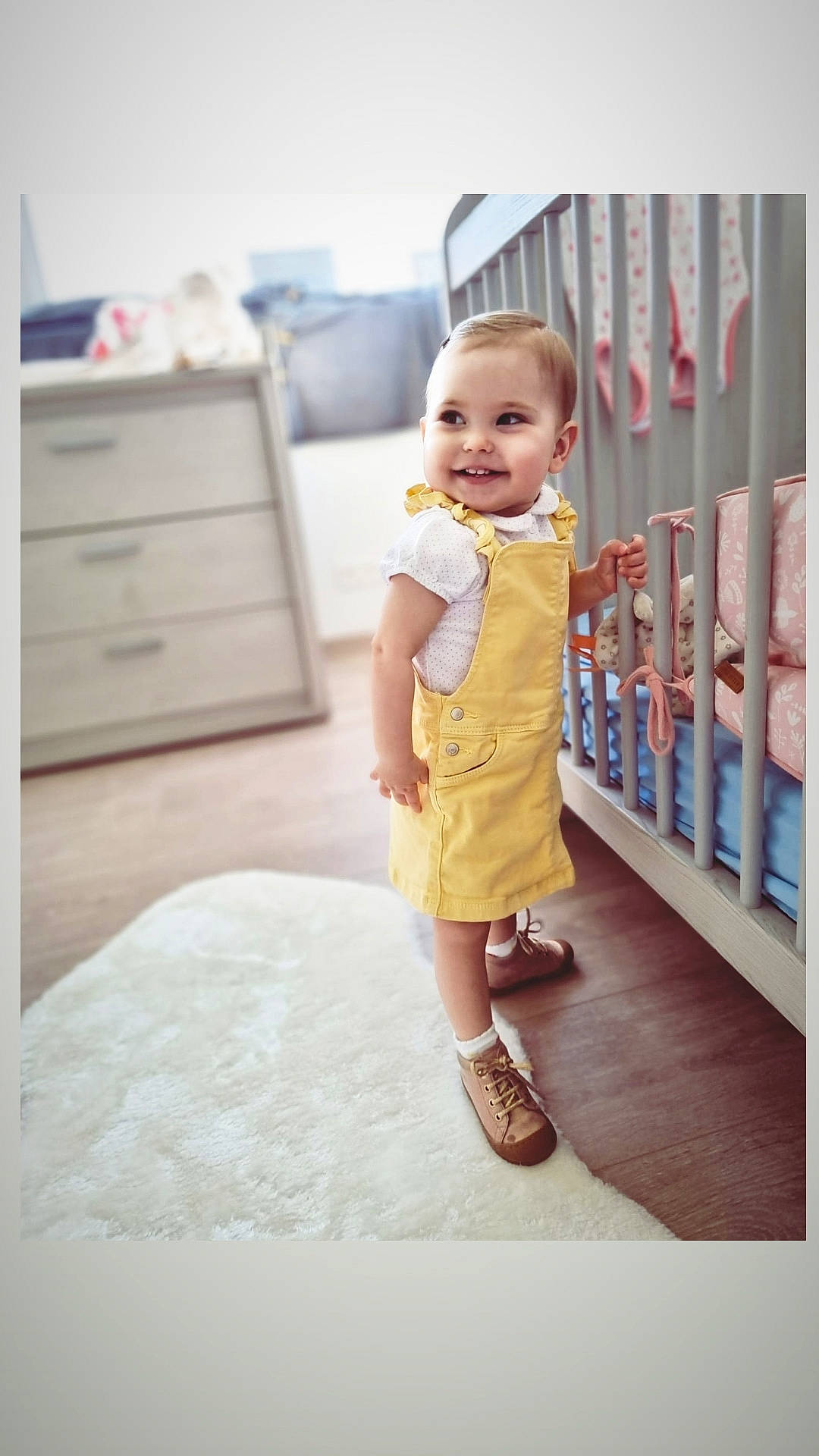 Olivia participe au concours pour gagner de l'argent avec cette photo : baby, baby_toddler_clothing, cabinetry, chest, chest_of_drawers, drawer, dresser, fence, floor, flooring, footwear, fun, happy, hardwood, human_leg, joy, pattern, person, sandal, sleeve