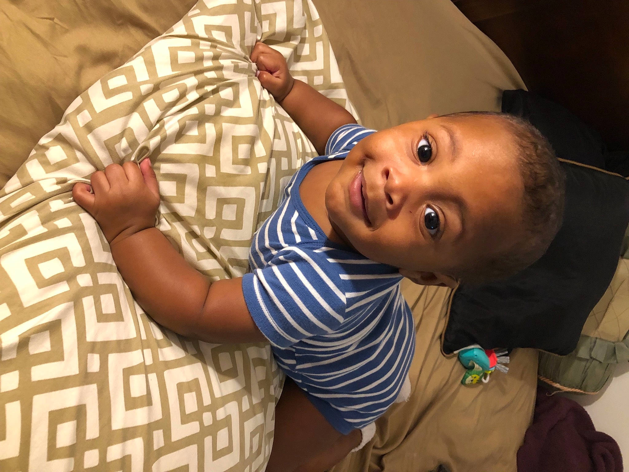 Marshawn is registered to the contest to win money with this photo: baby, cheek, comfort, elbow, eyebrow, facial_expression, finger, fun, gesture, hairstyle, happy, human_body, joy, lip, mouth, nose, person, skin, sleeve, smile