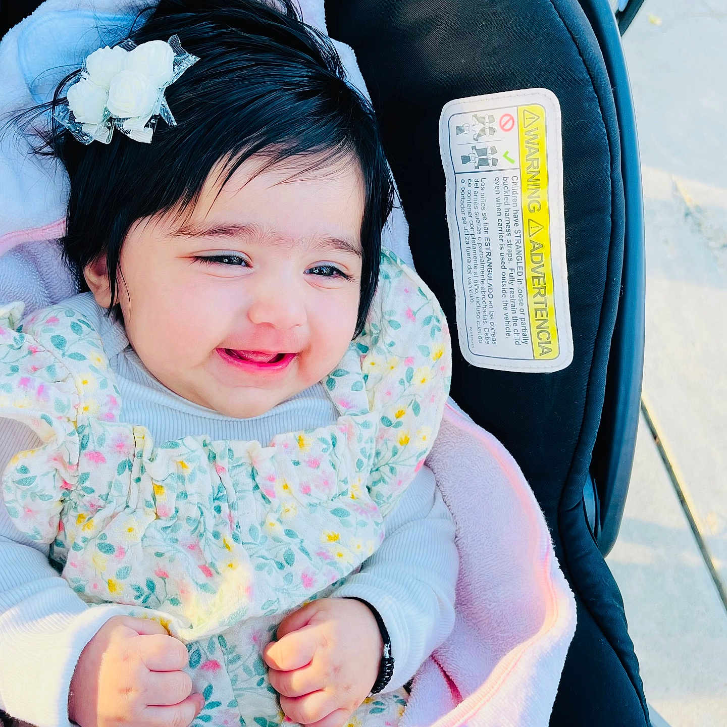 Tripat Kaur Cheema is registered to the contest to win money with this photo: baby, blanket, child, clothing, cute, face, floral_dress, flower_hair_clip, hands, happy, head, infant, outdoor, person, photography, portrait, skin, smiling, stroller, young