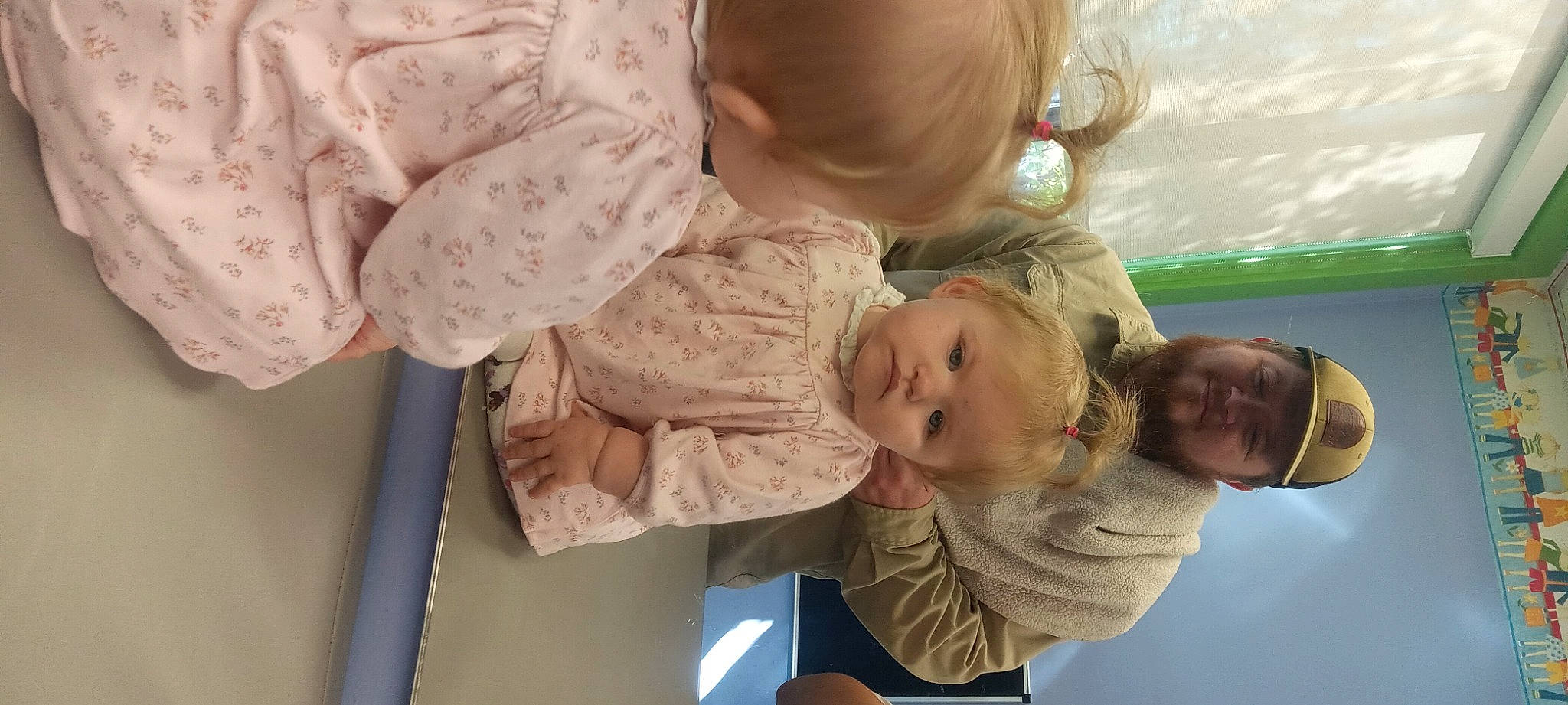 Winter is registered to the contest to win money with this photo: baby, baby_products, baby_toddler_clothing, cheek, child, comfort, fun, gesture, happy, headwear, human_body, mammal, pattern, person, room, sitting, skin, sleeve, standing, toddler