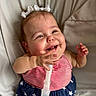 Raelynn is registered to the contest to win money with this photo: baby, child, smiling, happy, face, hand, clothing, dress, stars, stripes, bow, hair, medical_tube, breathing_tube, lying_down, fabric, closeup, infant, cute, indoors
