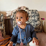 Tahyssia a rejoint le concours — aidez-le/la à gagner de superbes lots ! toddler, child, pacifier, blue_dress, white_tights, pigtails, hair_bows, sitting, couch, cushion, home_interior, soft_lighting, long_sleeve_shirt, toy, blanket, face, person, indoor, cute, calm