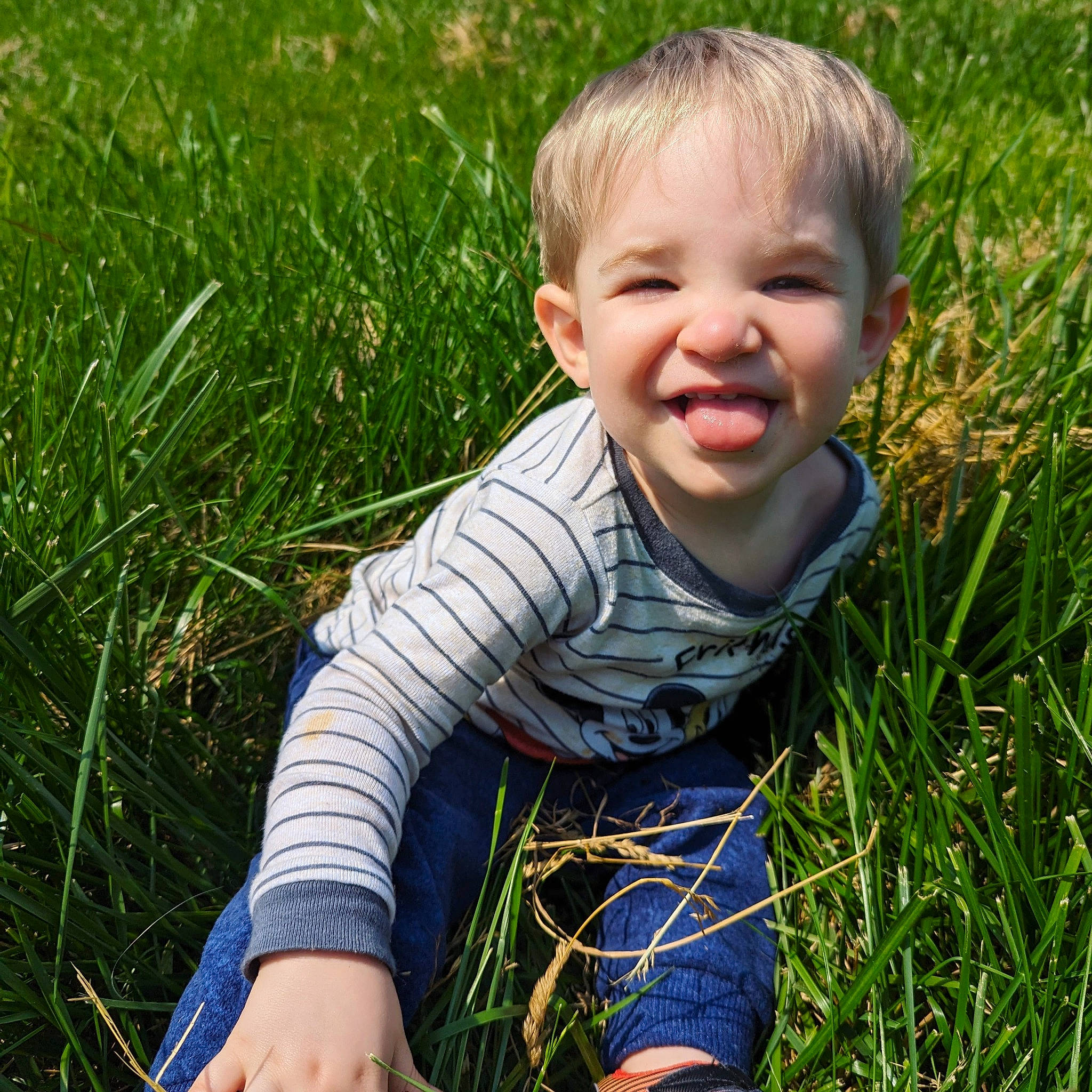 Louie joined the competition — help win amazing prizes! baby, baby_toddler_clothing, child, electric_blue, fun, grass, grass_family, grassland, happy, human_leg, iris, joy, lawn, leaf, meadow, people_in_nature, person, plant, smile, summer