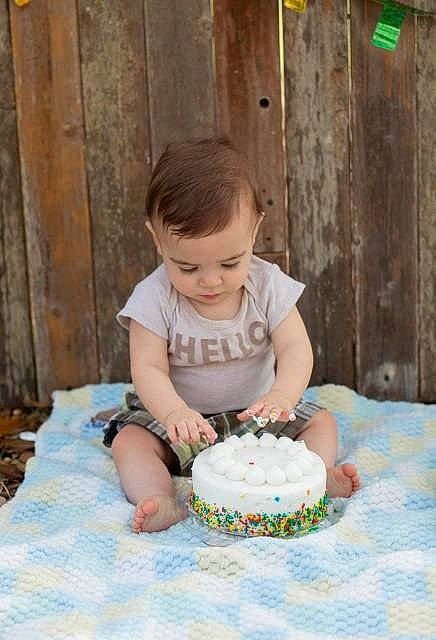 Kyle is registered to the contest to win money with this photo: baby_toddler_clothing, baked_goods, birthday_cake, buttercream, cake, cake_decorating, cake_decorating_supply, child, dress, food, fun, happy, icing, leisure, person, recipe, sugar_cake, sugar_paste, table, toddler