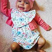 Caylin joined the competition — help win amazing prizes! baby, infant, smiling, pink_bow, headband, floral_outfit, lying_down, blanket, cute, happy, child, skin, face, small_hands, small_feet, indoors, portrait, baby_girl, fabric, soft_texture
