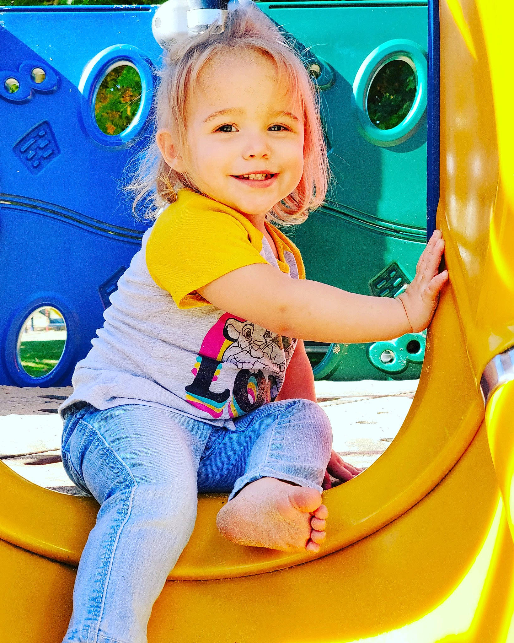 Annalee joined the competition — help win amazing prizes! baby, car, child, city, fun, human_settlement, joy, outdoor_play_equipment, person, play, playground, public_space, recreation, smile, toddler, vehicle, vehicle_door, yellow
