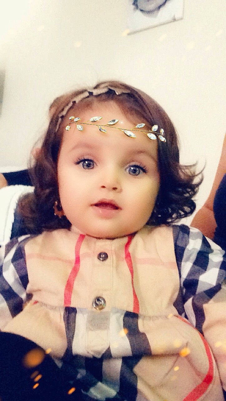 Victoria participe au concours pour gagner de l'argent avec cette photo : brown_hair, cheek, child, cool, doll, eye, forehead, girl, hair_accessory, head, infant, person, product, skin, toddler