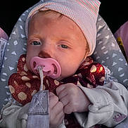 Aurora is registered to the contest to win money with this photo: baby, car_seat, child, closeup, clothing, cozy, cute, face, hands, hat, infant, knitwear, newborn, pacifier, polka_dot, portrait, scarf, sleepy, soft_light, warm