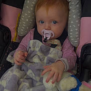 Aurora joined the competition — help win amazing prizes! baby, blanket, blue_eyes, car_seat, child, clothing, comfort, cute, face, hand, indoor, infant, pacifier, patterned_blanket, plush_toy, portrait, red_hair, seat_belt, soft_texture, toddler