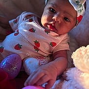 Jaelani joined the competition — help win amazing prizes! baby, infant, child, strawberry_pattern, headband, pink_clothing, easter_eggs, hand, soft_toy, blanket, indoor, portrait, cute, curious, closeup, face, skin, person, newborn, cozy