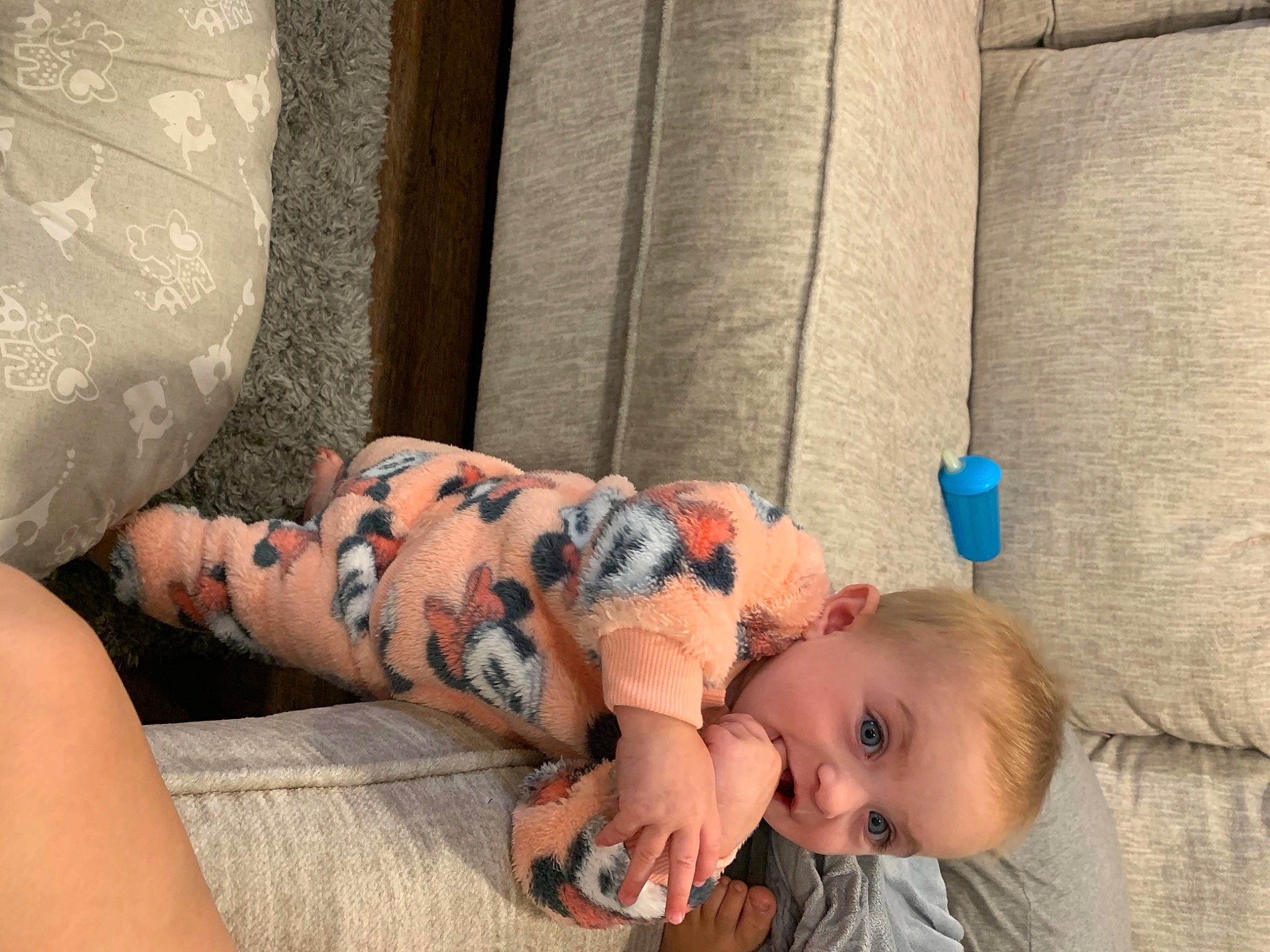 Malaya is registered to the contest to win money with this photo: abdomen, baby, baby_toddler_clothing, child, comfort, elbow, finger, flooring, human_leg, joint, linens, mammal, orange, pattern, person, sitting, skin, textile, thigh, toddler